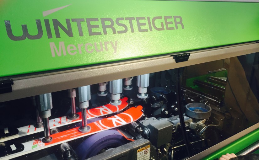 New race ski prep work being done on the Wintersteiger Mercury ski tuning machine at Peak Performance Ski Shop.